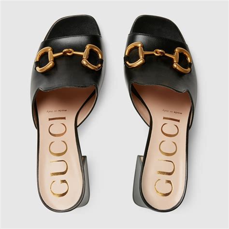 gucci slide sandals with horsebit.